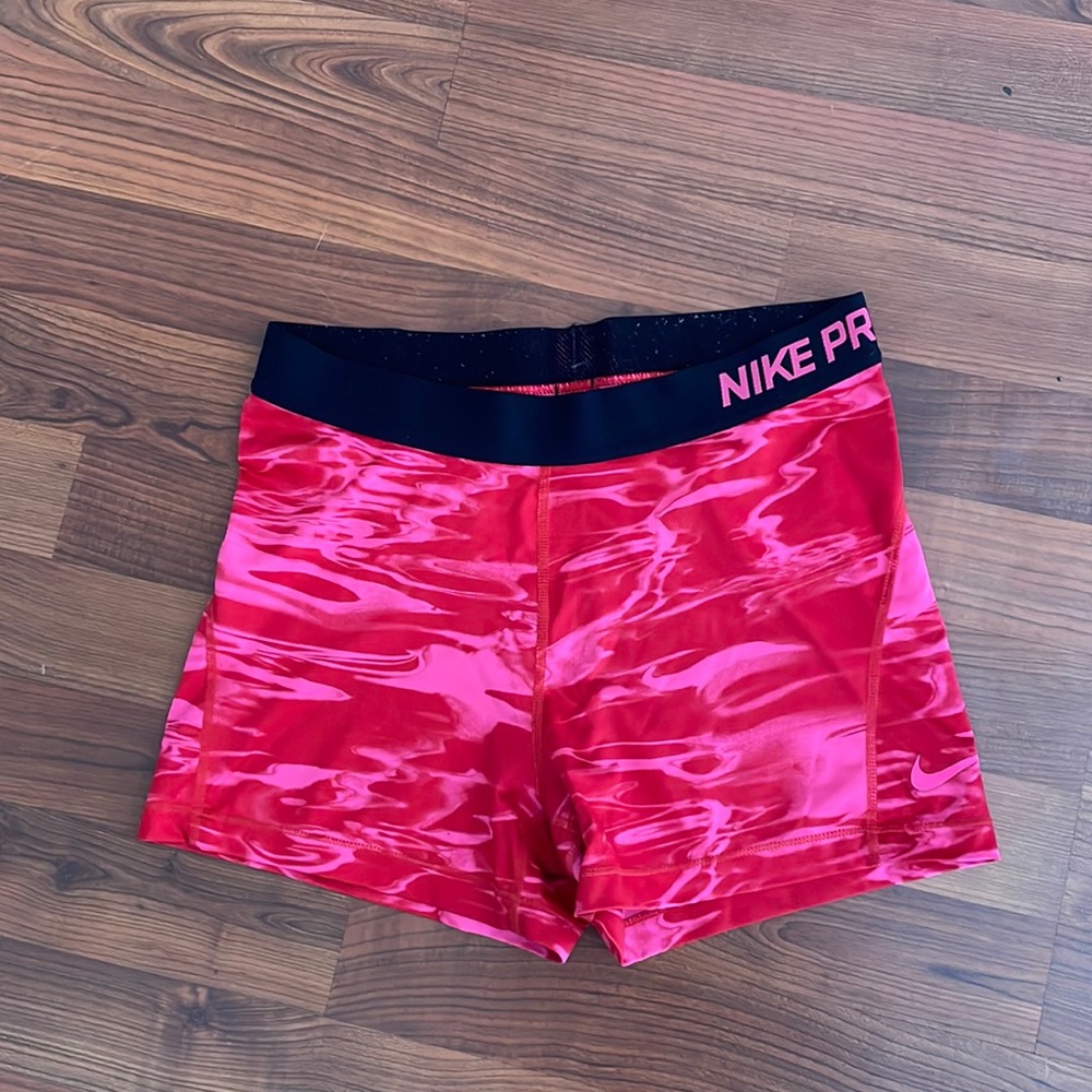 Pink and Red Nike Pros